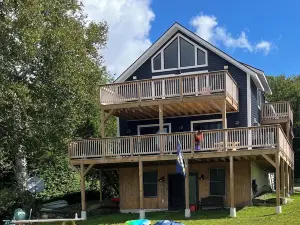 Experience Lakeside Living with a Perfect Blend of Rustic Charm & Modern Luxury