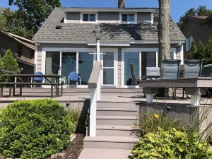 Experience Lake Life at Our 3-Bedroom Beachfront Cottage, Near Grand Rapids.