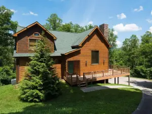Amazing log and stone home with a mountain setting and view of Norris Lake!
