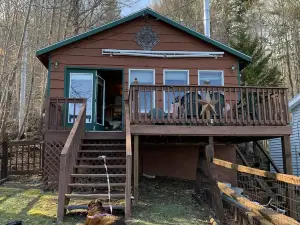 Waterfront Camp with Boathouse - Wifi, kayaks, canoe and sandy bottom out front.