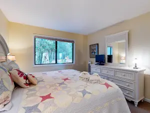 Riverfront condo with lake and river access, fireplace, firepit & gym