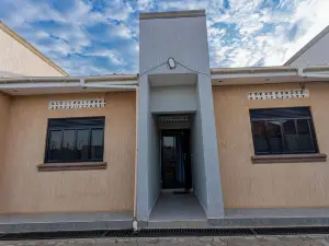 The Den Soroti Red & White