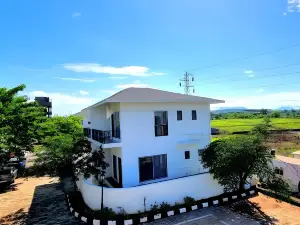 Spanish-inspired 2 BHK White Villa - Brinla Homes