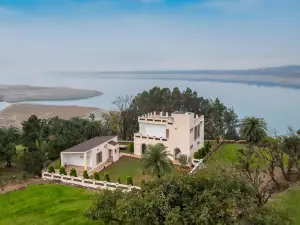 StayVista's Lake Pearl Serenity - Riverside, Mountain-View Villa with Jacuzzi, Sprawling Lawn & Terr