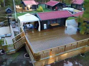 Timber Cottages with Jacuzzi and Sauna Near Lake Vänern