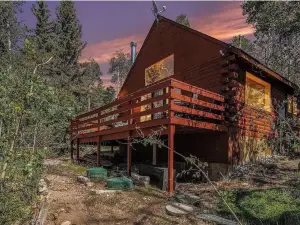 Mountain Cabin surrounded by woods and views.