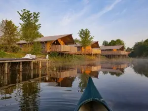 Tents with Kitchen and Bathroom Near a Pond