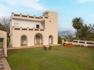 StayVista's Lake Pearl Serenity - Riverside, Mountain-View Villa with Jacuzzi, Sprawling Lawn & Terr
