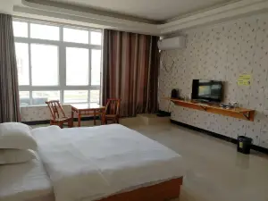 Xinxian Guangcai Hotel
