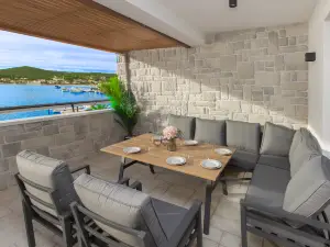 Seafront villa Kupinica with private indoor Pool