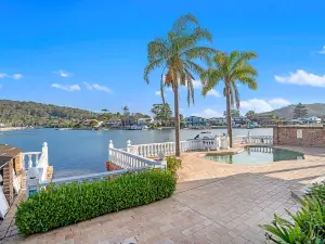 Stunning 4BR Holiday Home with Water Views & Pool