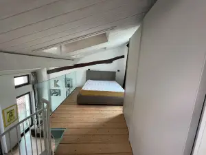 Open-plan loft overlooking Lake Como with private parking space