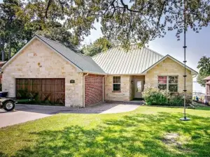 Bright, open concept, lakefront house on open water with amazing sunset views!