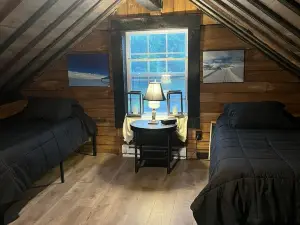 Nestled along the Mettowee River this charming  2-bedroom cabin in  Whitehall
