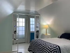 Sea-Breeze Cottage perched on the edge of the bay.