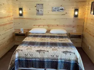 Lake view 2 bedroom cabin that sleeps 6. Private deck and fire pit area.