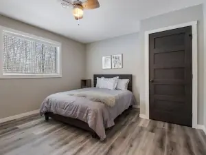 Up North Living!  Fully renovated one-level living home in wooded lot near lake.
