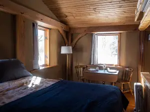 Straw clay sauna house on organic farm