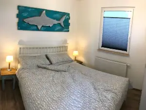 Modern, bright vacation home with lots of sun and its own jetty