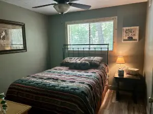 This relaxing cabin is cozy and secluded with private pond and fishing dock