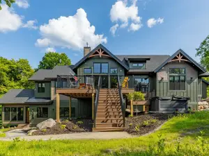 Private lakeside retreat with pool, hot tub, and sauna