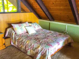 Chalet-style lakefront home with private dock, beach, kayak, canoe & epic view