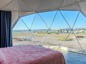 Luminous Cozy Dome with a Barbie Collection Above Bed in Willcox, Arizona