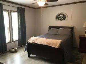 3BR, 2 Bath house with full kitchen, living room, and hot tub.