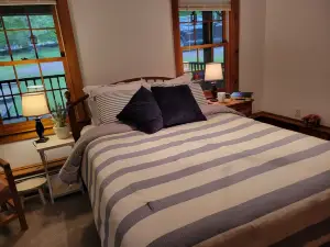 Relax and unwind - 4 bedrooms, 2 full baths, screened in porch & yard for kids.