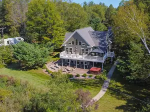 "Home Away From Home" nestled into five private acres on an all sports lake!