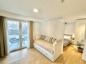 Minimalist Seaside Apartment with Patio + Parking