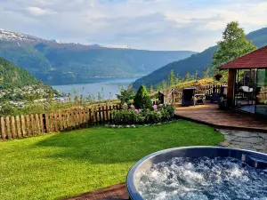 Mountain & Fjord View Apartment | Private Garden & Hot Tub